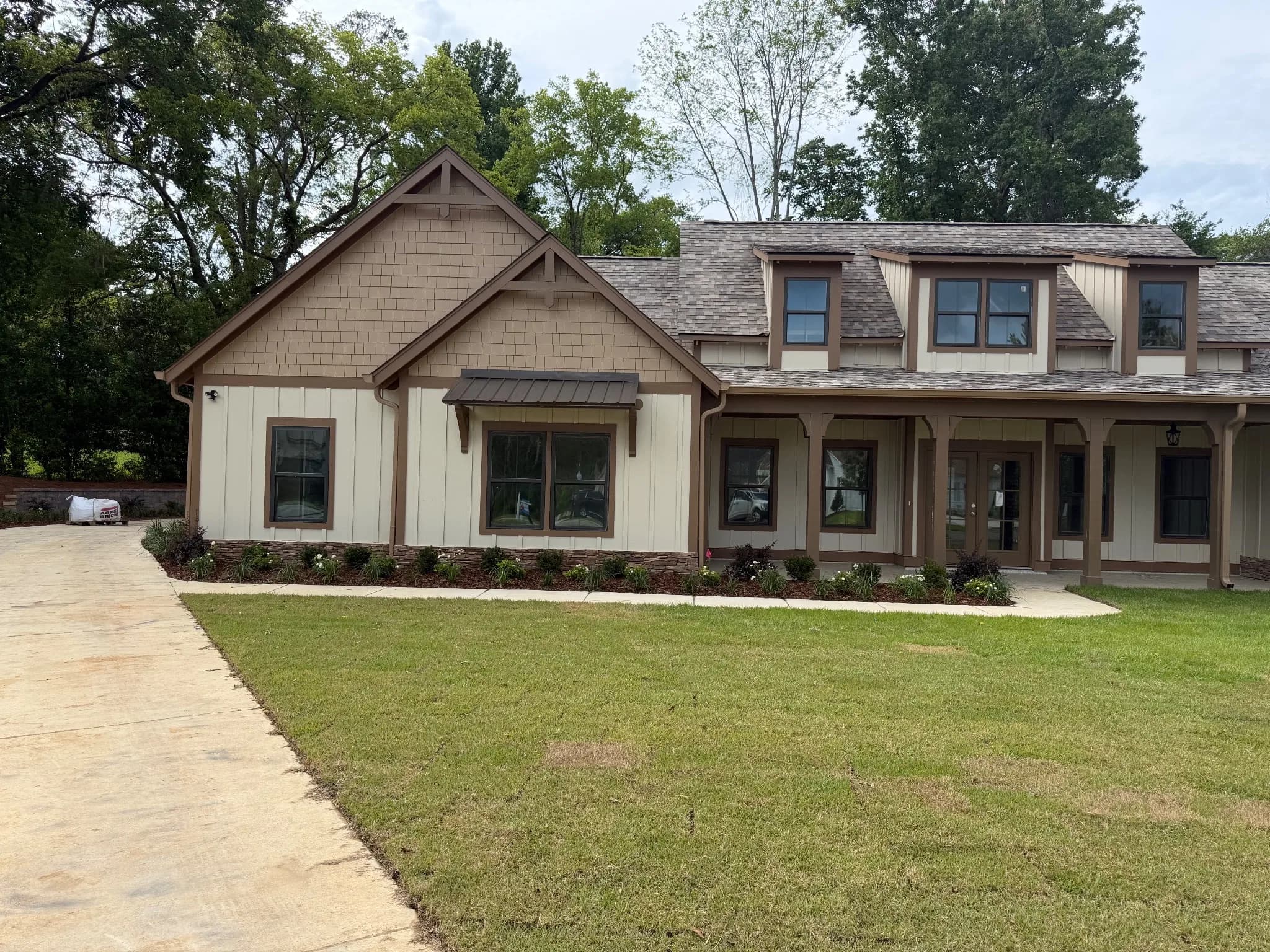 Finished landscaping with a nicely manicured lawn and house exterior.